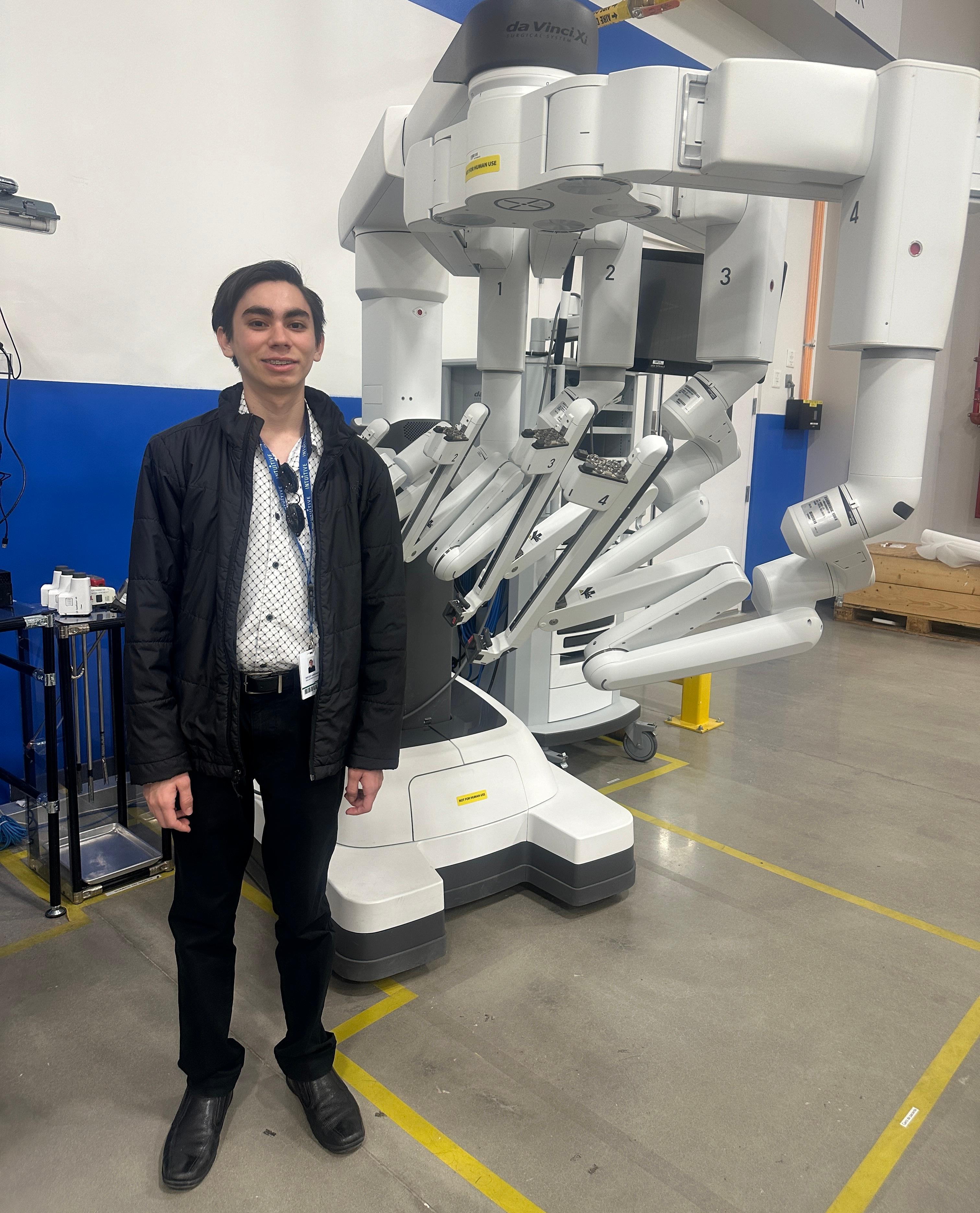 Diego Lorenzo Villalobos with Da Vinci Xi Robot at Intuitive Surgical